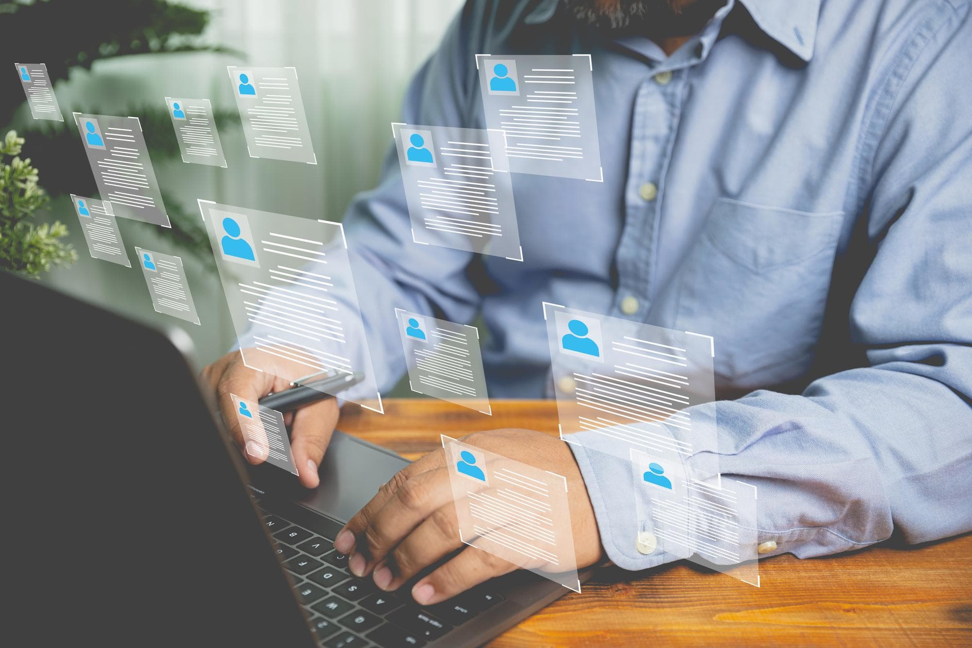 The human resource manager is recruiting employees Checks the CV online to choose the perfect employee for his business The human resources system is digital and online