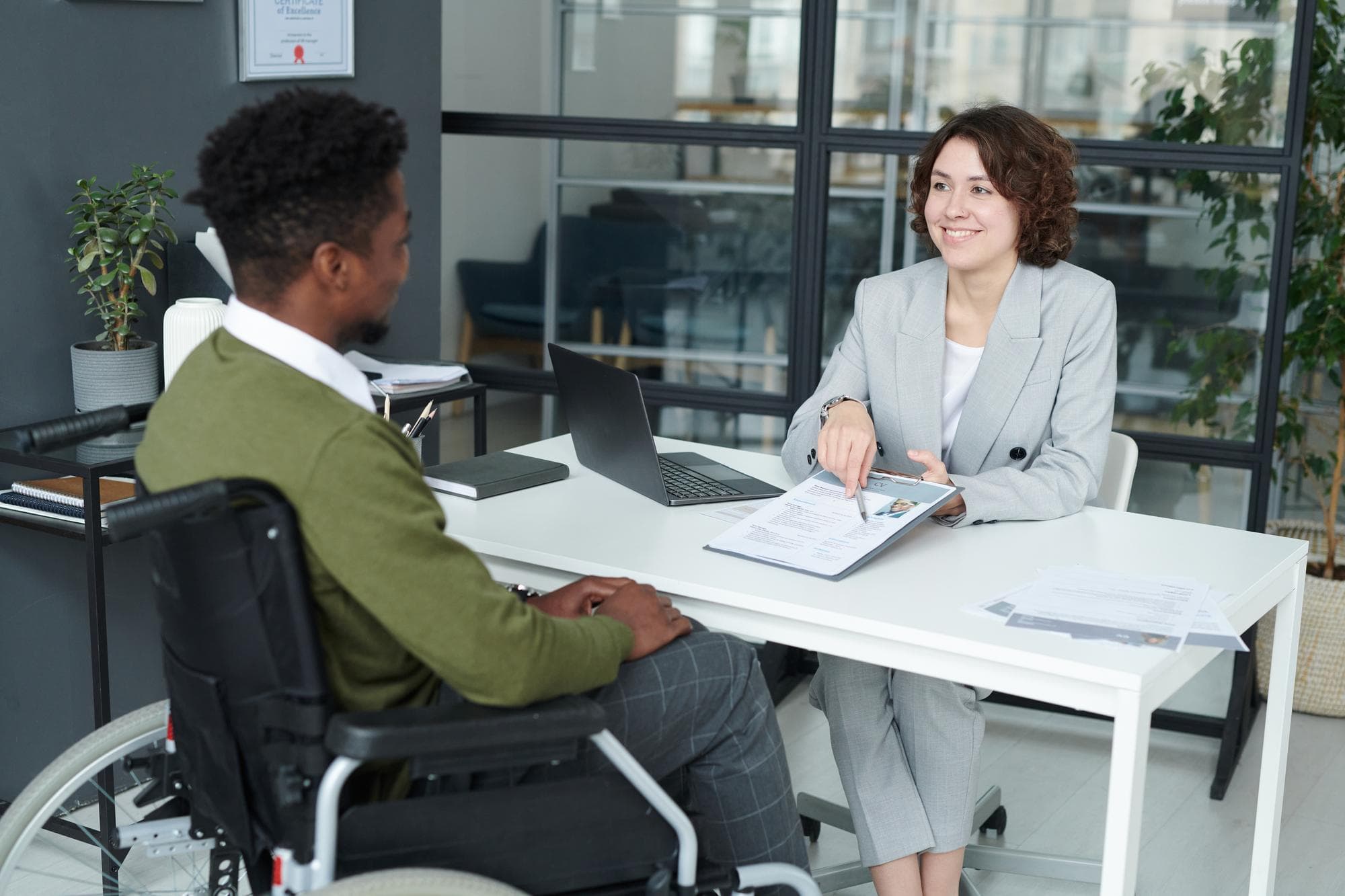 Manager discussing resume with candidate with disability