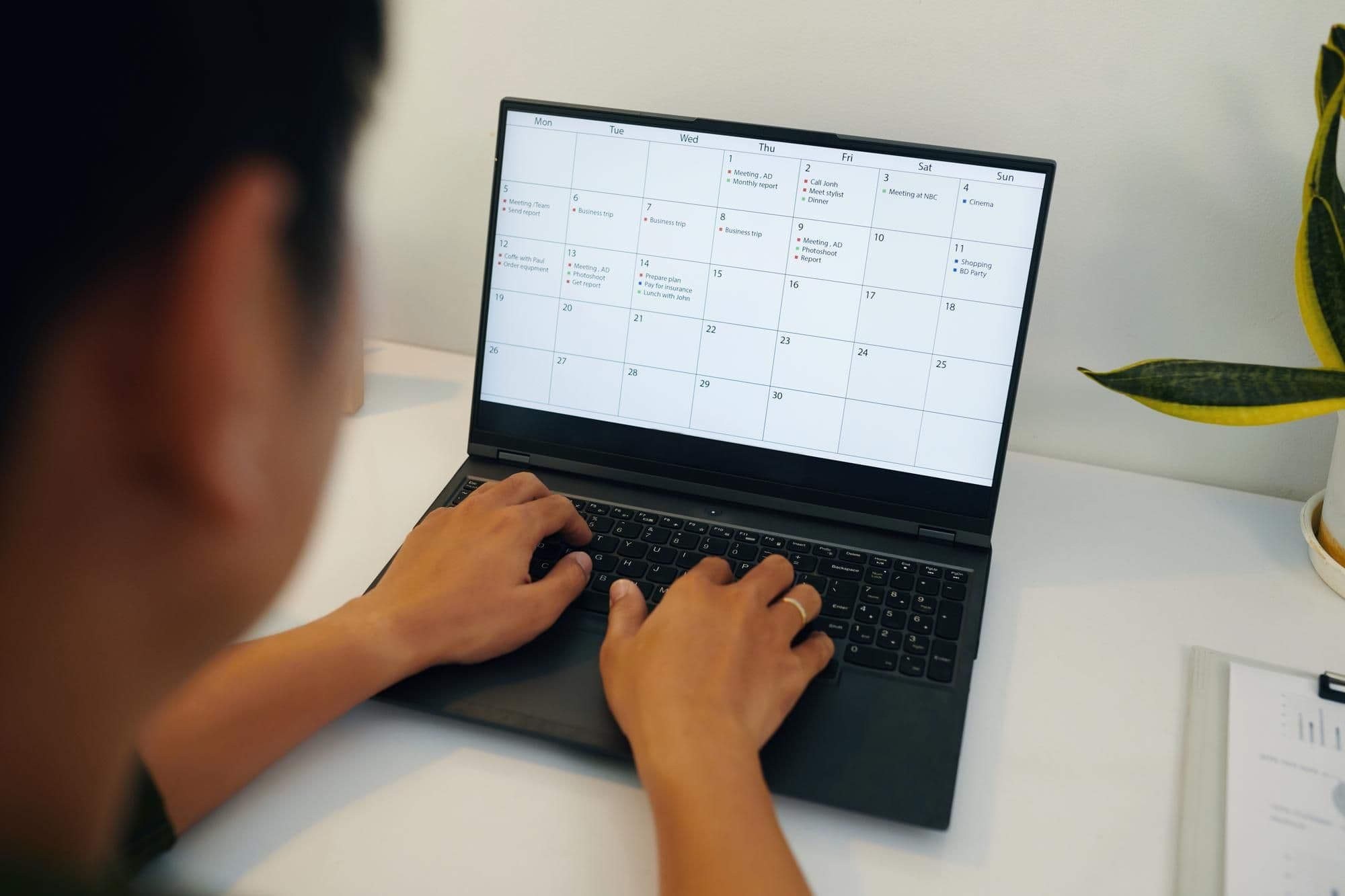 Businessman Checking His Timetable On Laptop