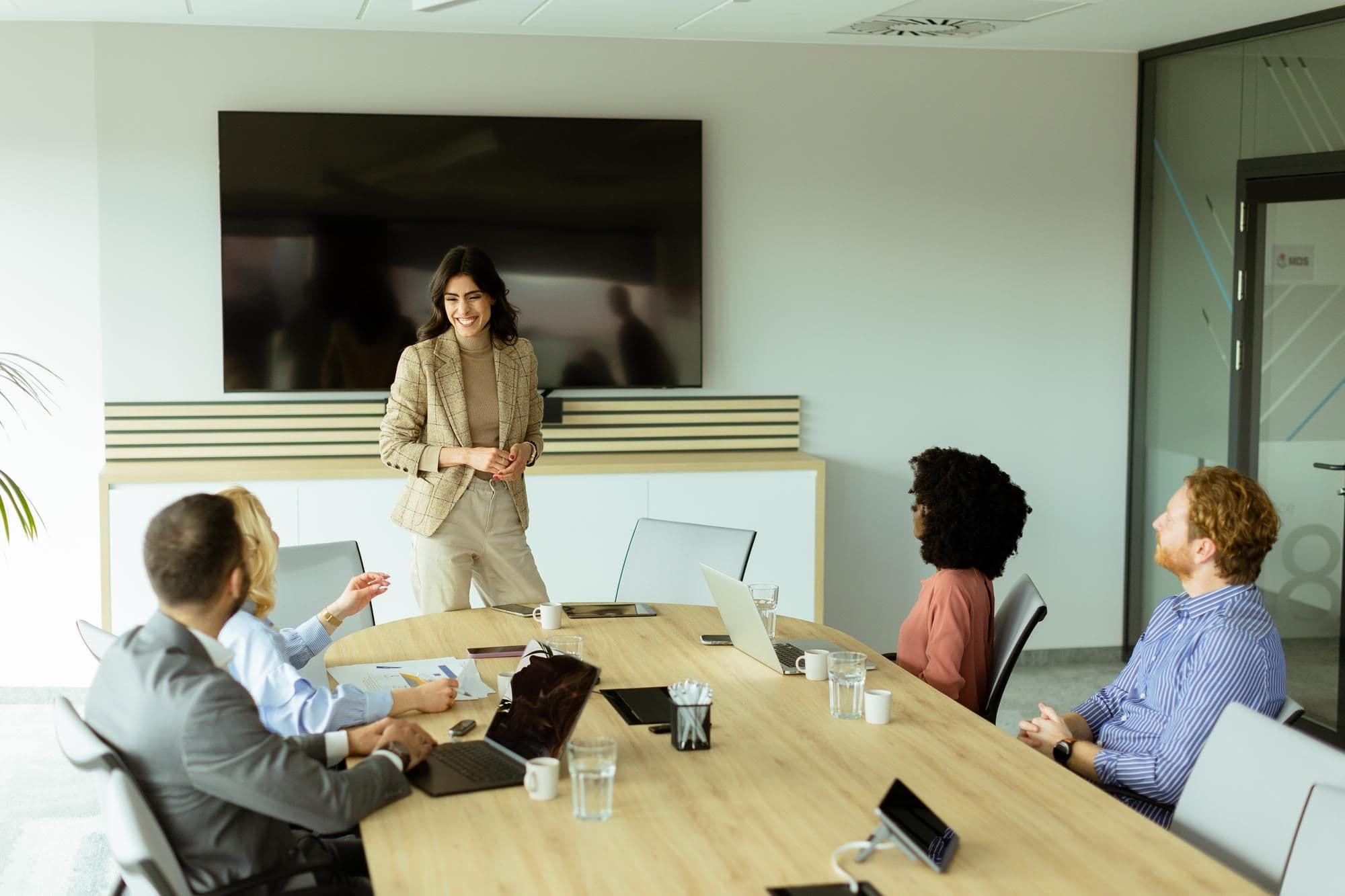 Confident businesswoman leading a strategic planning session in a modern office