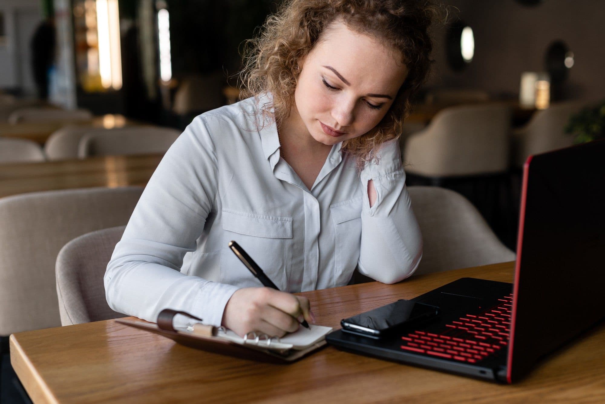 Charming student browses information on a laptop connected to 4G Internet.